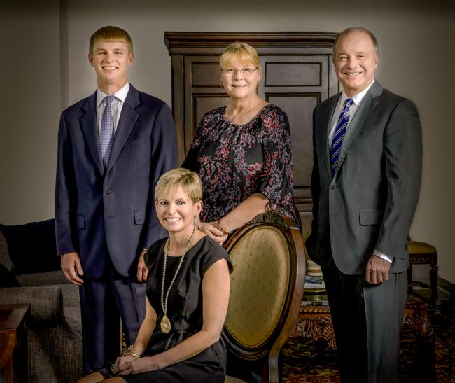 An image of the Way & Way team - Jane Goodyear sits in the front and behind her from left to right are Reese Way, Rose Siron, and Dennis Way